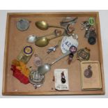 A wooden tray of badges, enamel, advertising, shipping Co spoons etc.