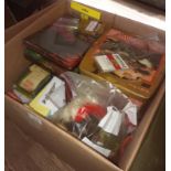 A box containing a large amount of fly tying materials including furs, feathers, hooks, leaders etc.