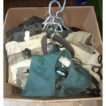 A box containing fishing clothing including winter trousers, waterproof jackets, waistcoats and a