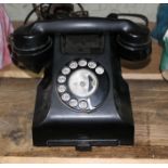 A vintage bakelite GPO telephone.