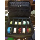 An Airflo padded bag containing 9 spools of fly line.