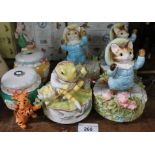 A group of four Border Fine Arts Beatrix Pottery musical models and two similar Winnie the Pooh