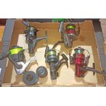 A box containing five fixed spool reels including Shimano Carbomatic GT4000 with spare spool,