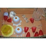 A box of assorted items including vaseline glass shades, a pressed glass dish, cranberry wine