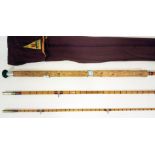 A vintage 14'7" three piece split cane salmon rod, unmarked, in Milbro bag Good condition, some