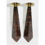 A pair of inlaid wooden candlesticks with brass finials, height 29cm.