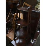 An Edwardian mahogany folding cake stand, height 84cm and width 39cm.