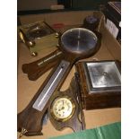 A box of barometers and clocks.