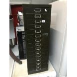 A metal 15 drawer filing cabinet