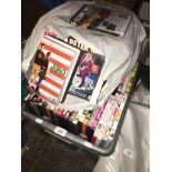 A box and a bag of various DVDs, over 100