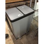 A foot operated twin bin