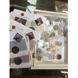 A box of Commonwealth crowns and coins.