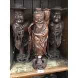 A pair of Chinese large sage figures and another.