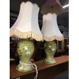 A pair of green table lamps decorated with flowers, height 70cm.