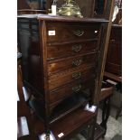 An Edwardian mahogany music cabinet, height 76.5cm, width 54.5cm and depth 39.5cm.