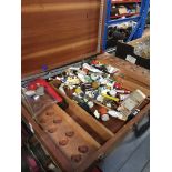 A large artist's paint box with contents.