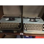 2 vintage Olympia typewriters.