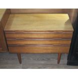 A Danish style teak chest of drawers, height 66cm, width 82cm and depth 45cm.