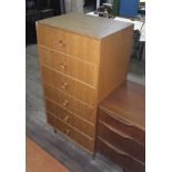 A Meredew tall light oak chest of drawers, height 124cm.