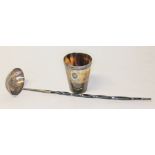 A hallmarked silver ladle with twist horn handle and a horn beaker with hallmarked silver rim.