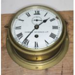 A ship's bulk head clock signed Dobbie McInnes, diameter 20.5cm.