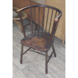 A dark beech tall spindle back chair.