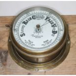 A ship's bulk head barometer signed S.D. Neill Belfast, diameter 23.5cm.