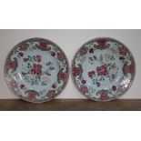 A pair of Chinese 18th/19th century famille rose dishes, diam. 28.5cm. Condition - one with chip