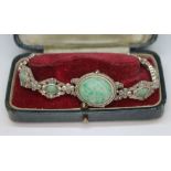 A ladies silver bracelet watch set with mottled green cabochons, marked '925 Sterling Silver'.