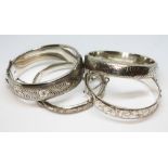 A group of four hallmarked silver bangles, gross weight 100.86g.