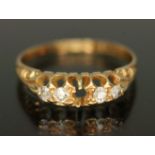 A hallmarked 18ct gold four stone diamond ring, gross weight 1.84g, size H/I.