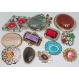 A group of twelve vintage brooches, some set with hard stones, some paste and one enamelled etc.