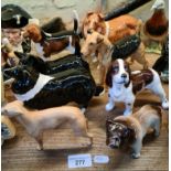 A group of 8 Beswick dogs