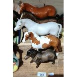 A group of 3 Beswick horses and 2 ponys