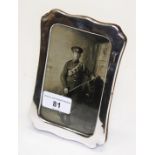 A silver photograph frame, Birmingham 1917, length 16cm.