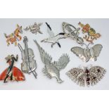 A group of ten vintage brooches comprising an enamelled seagull marked 'Sterling Silver', a nude