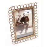 A brass chain pattern photograph frame, length 22cm.