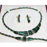 A suite of malachite jewellery comprising necklace, pair of earrings and a bracelet, marked '950'.