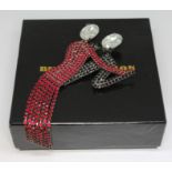 A vintage Butler & Wilson brooch modelled as a dancing couple, with box.