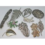 A group of ten vintage floral brooches including one stamped 'S. Ramsay', one marked 'Silver',