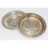 A pair of silver pin dishes with rosette design to interior, C J Vander Ltd, London 1973, diameter