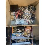 A box containing various items of costume jewellery.