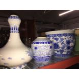 An oriental blue and white jardiniere, ginger jar and vase.