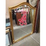 Gold colour arched mirror