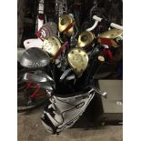 Ping golf bag with clubs.