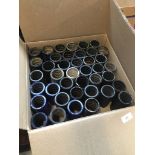 A box containing approximately 40 cylinder records.