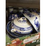A collection of blue and white ware, mostly willow pattern.