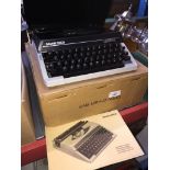 A Silver Reed portable typewriter with manual.