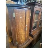 A Georgian oak corner cabinet.