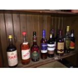 11 bottles of alcoholic beverages, cognac, port, sherry, Metaxa, etc. - some sealed and some open.